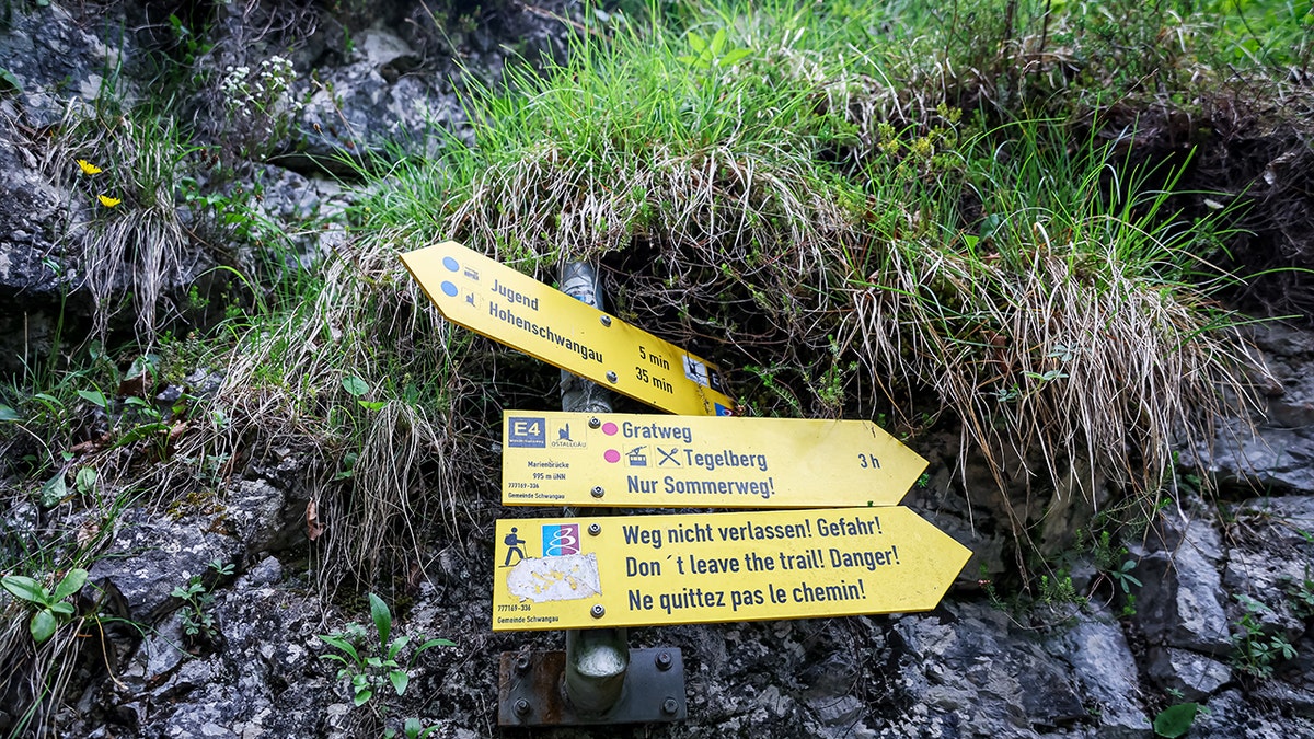 A sign close to the Marienbruecke bridge over the Poellat gorge near Neuschwanstein Castle following the death of a 21-year-old female American student, on June 16, 2023 near Fuessen, Germany.