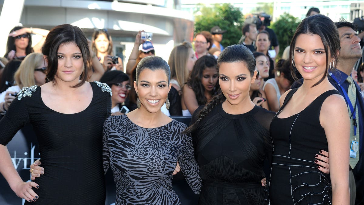 Kylie Jenner, Kourtney Kardashian, Kim Kardashian, and Kendall Jenner pose together on the red carpet
