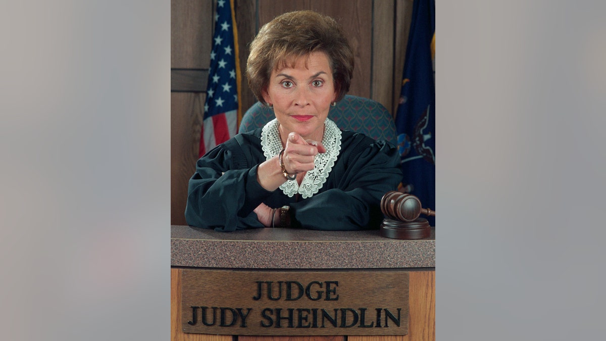 Judge Judy Sheindlin in her judge's robes on the set of Judge Judy