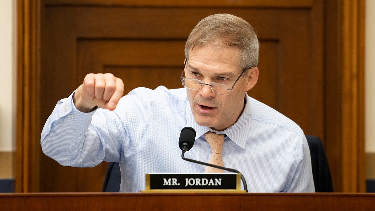 Jim Jordan gesturing with right hand on dais at congressional hearing