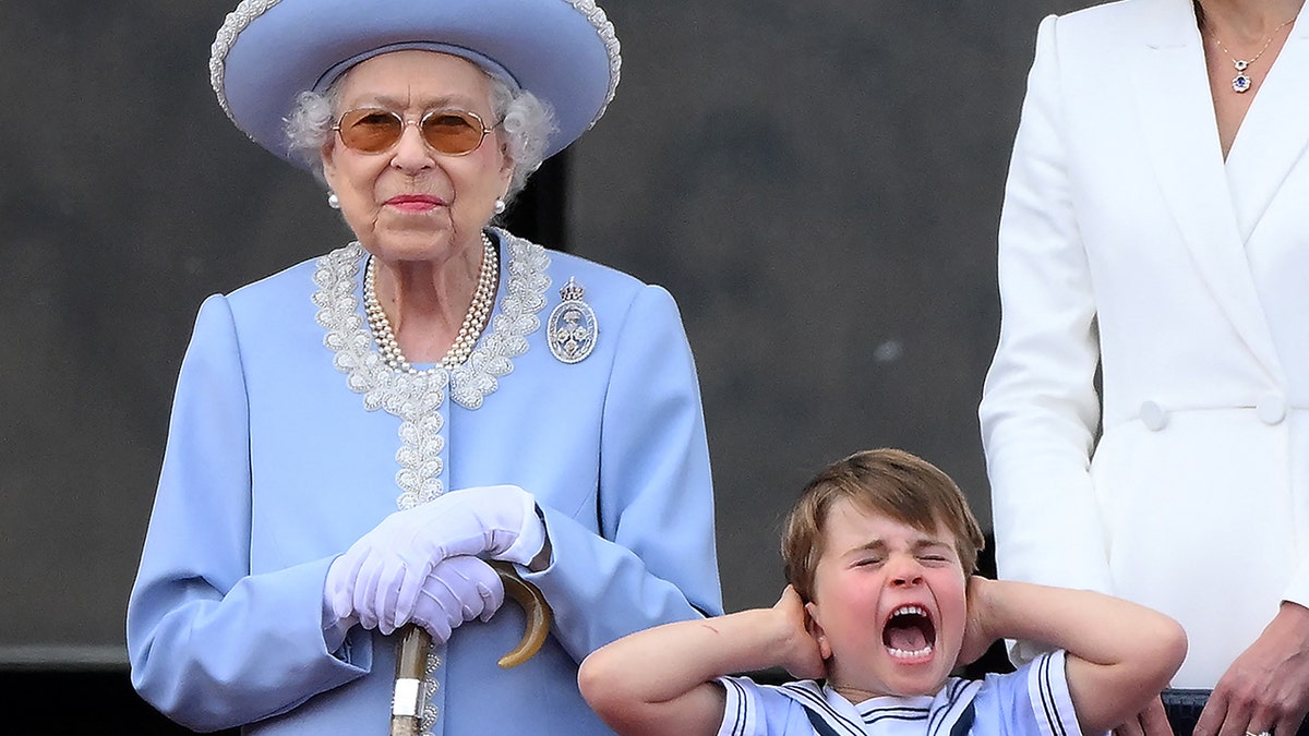 Prince Louis shouts and covers his ears as there is a special flypast over Buckingham Palace in front of Queen Elizabeth for her Platinum Jubilee