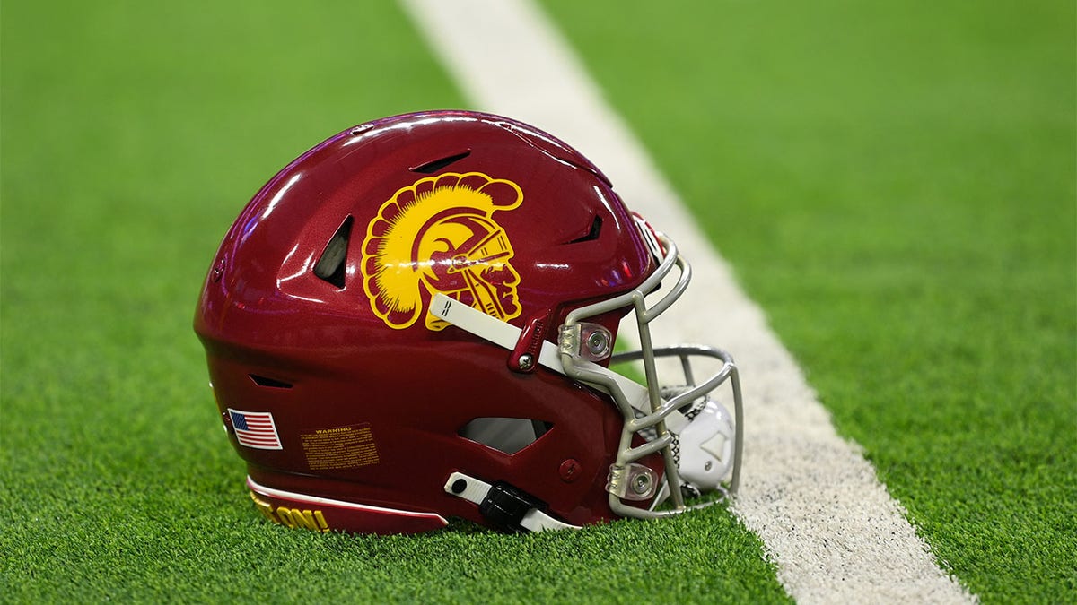 A football helmet is displayed after a news conference announcing News  Photo - Getty Images