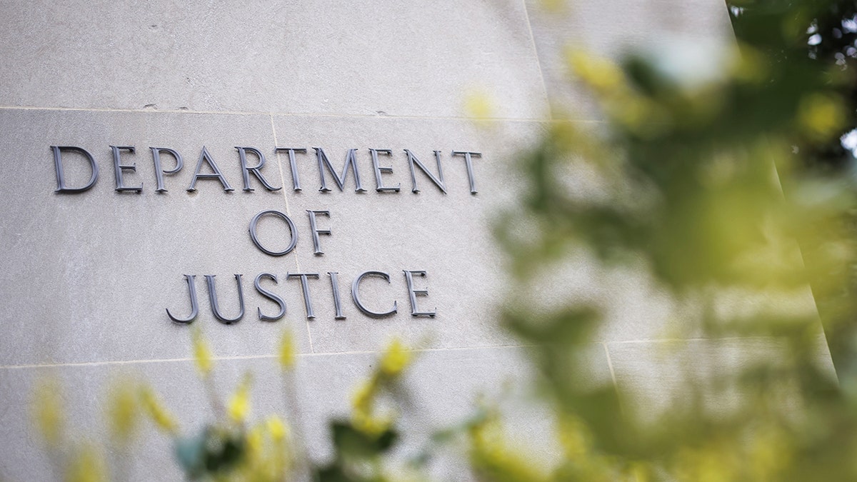 A sign on the outside of the Department of Justice in DC