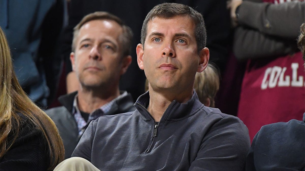 Brad Stevens watches a college basketball game