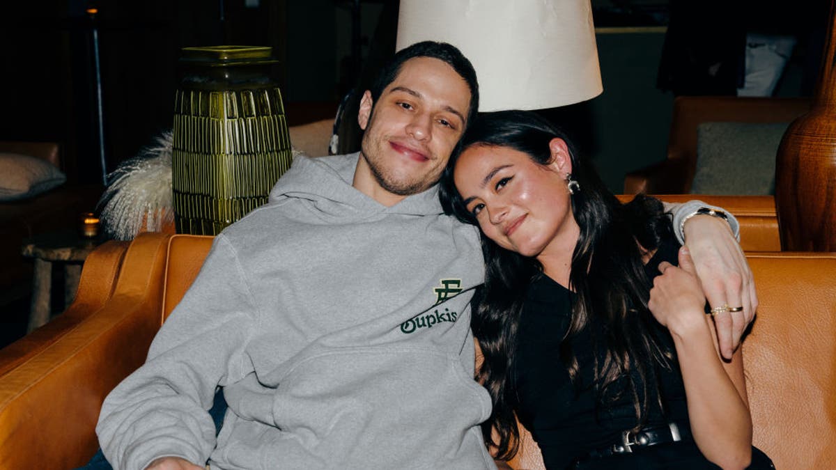 pete davidson cuddling with his girlfriend chase sui wonders on a couch at the bupkis after party