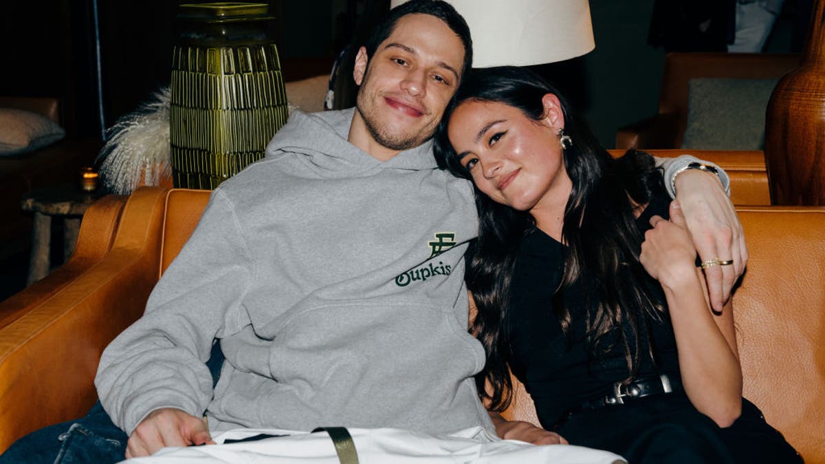 pete davidson cuddling with his girlfriend chase sui wonders on a couch at the bupkis after party