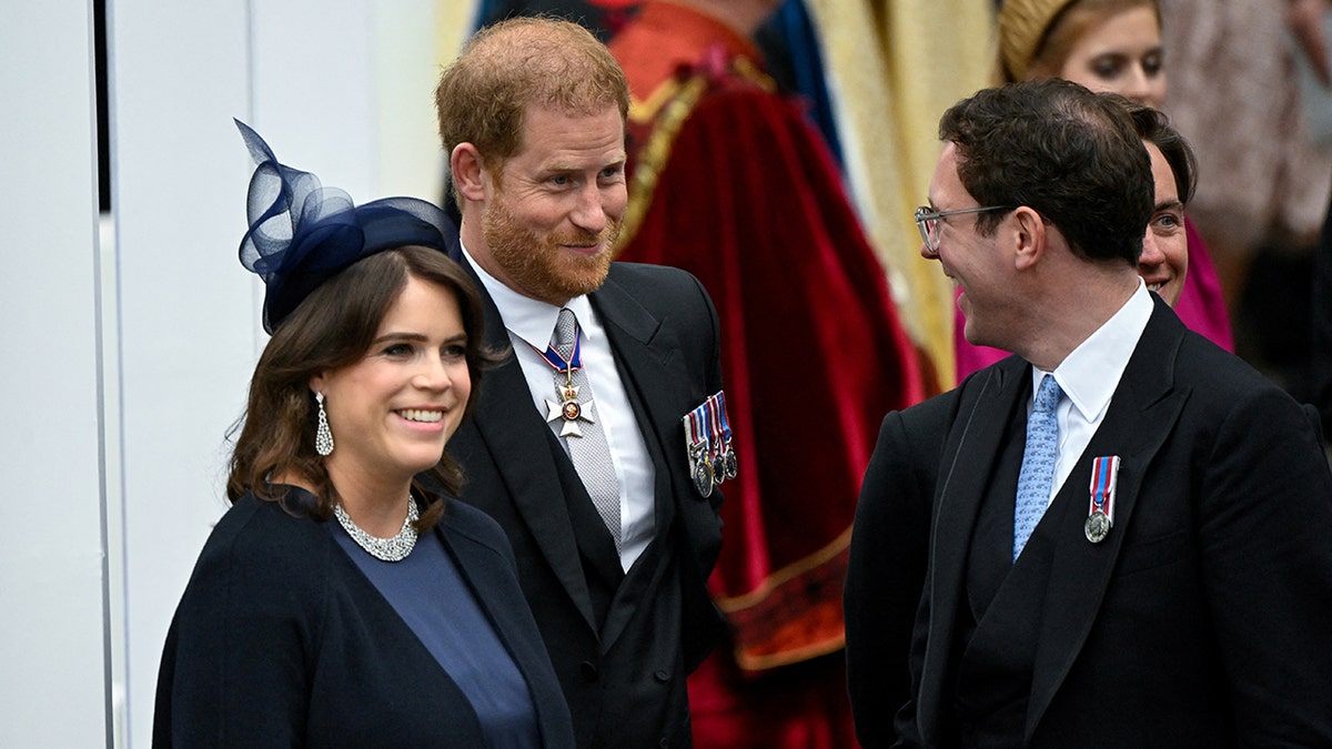 Prince Harry shares a laugh with Princess Eugenie and her husband Jack while at the Coronation of King Charles
