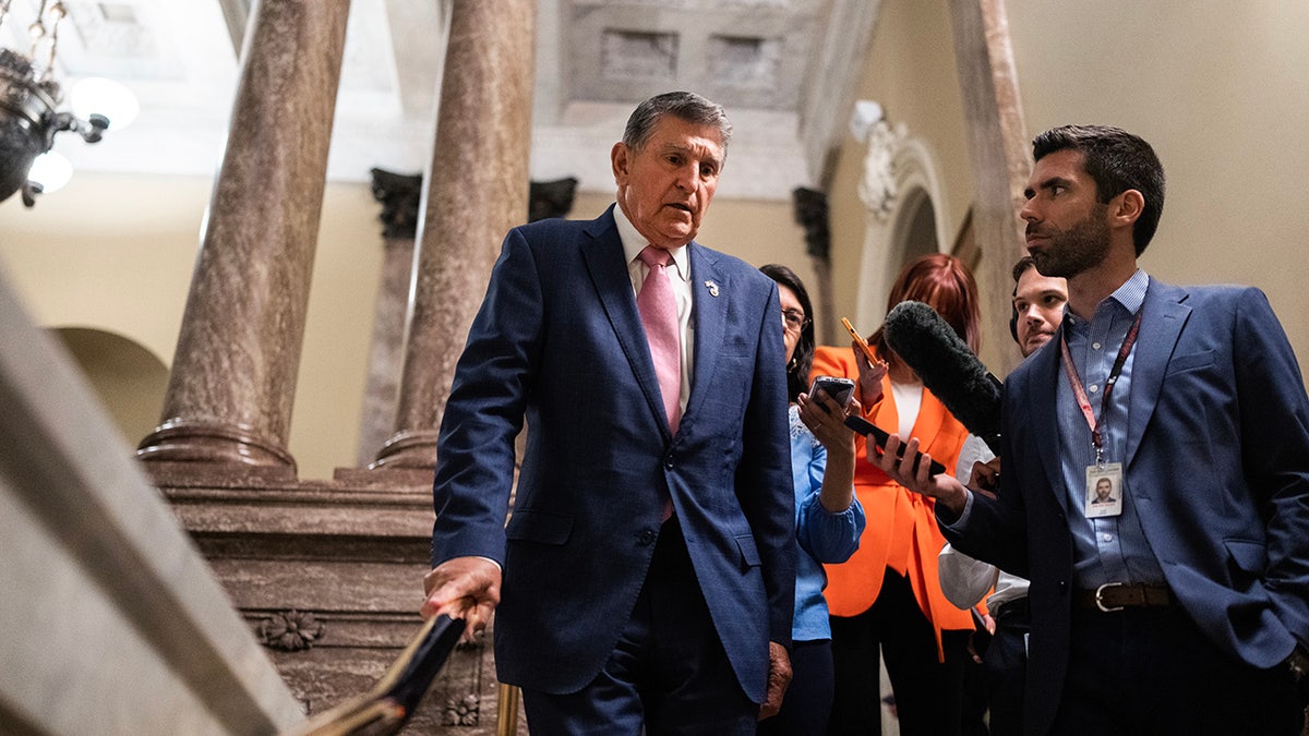 Joe Manchin greeted by press on Capitol Hill