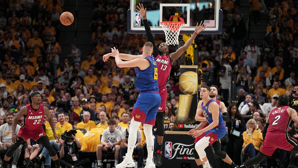 Nikola Jokic passes against the Miami Heat