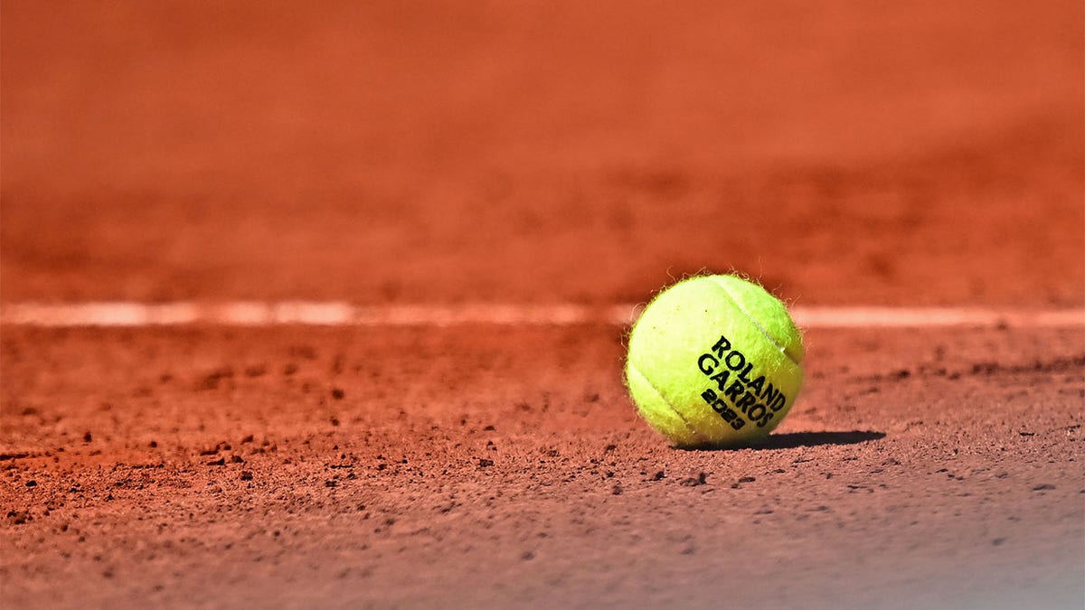 A tennis ball on the clay