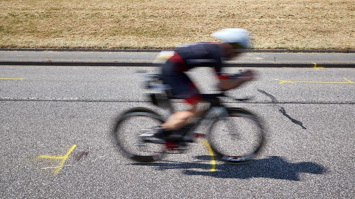 An athlete passes the site of the crash