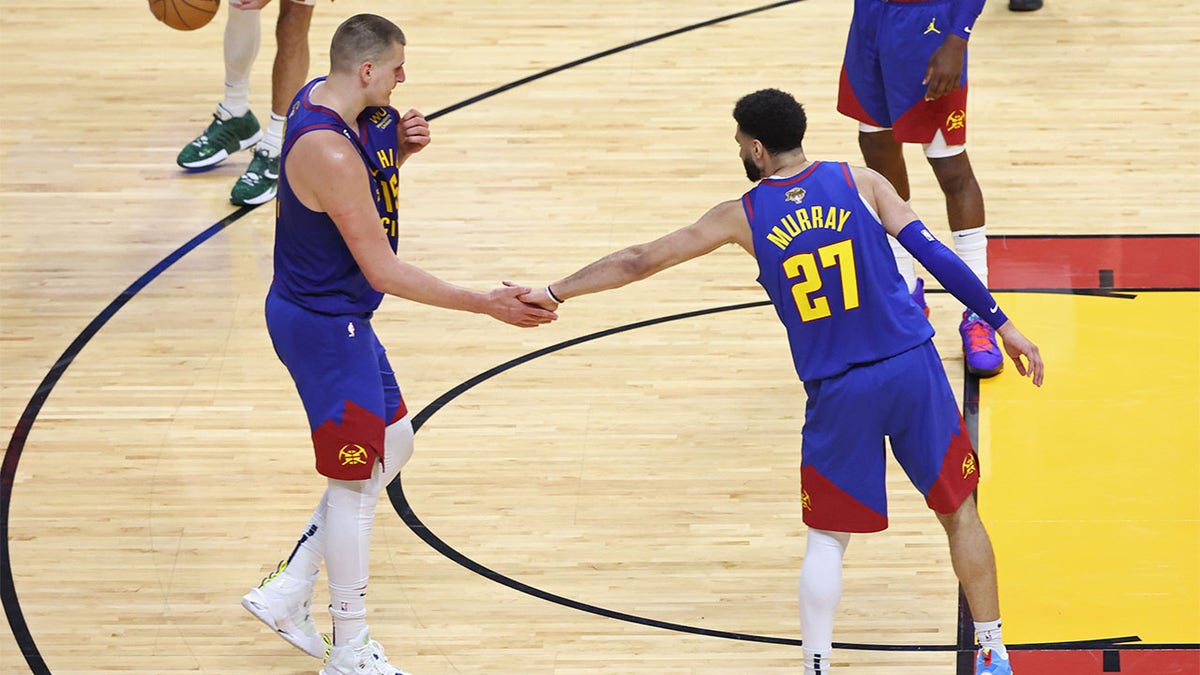 Nikola Jokic and Jamal Murray high five