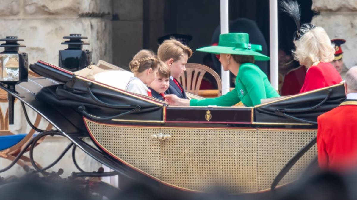 Princess Kate fixing Prince Louis