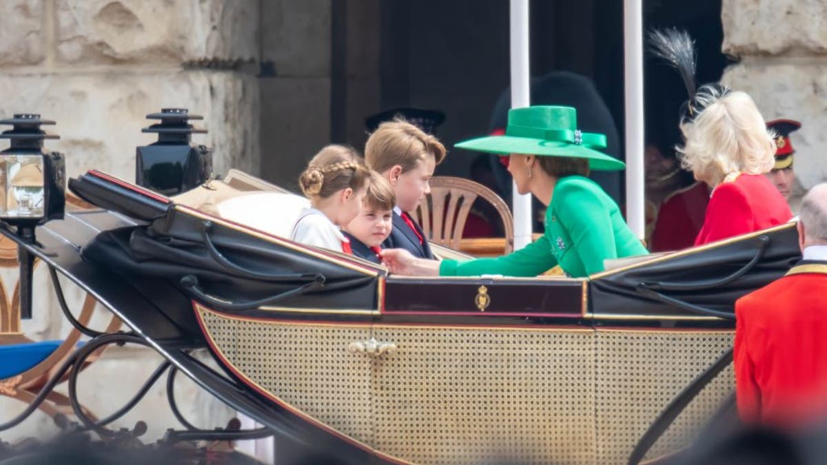 Princess Kate fixing Prince Louis