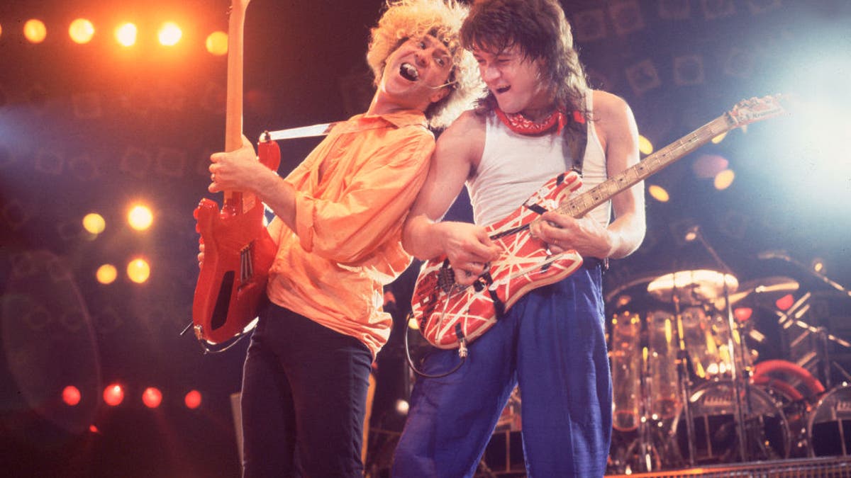 sammy hagar performing on stage with eddie van halen