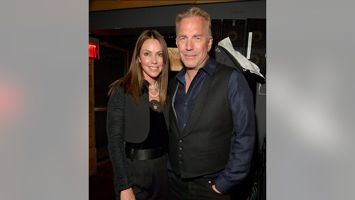 Kevin Costner and his wife Christine smiles for a photo at the OmniPeace Foundation in Los Angeles