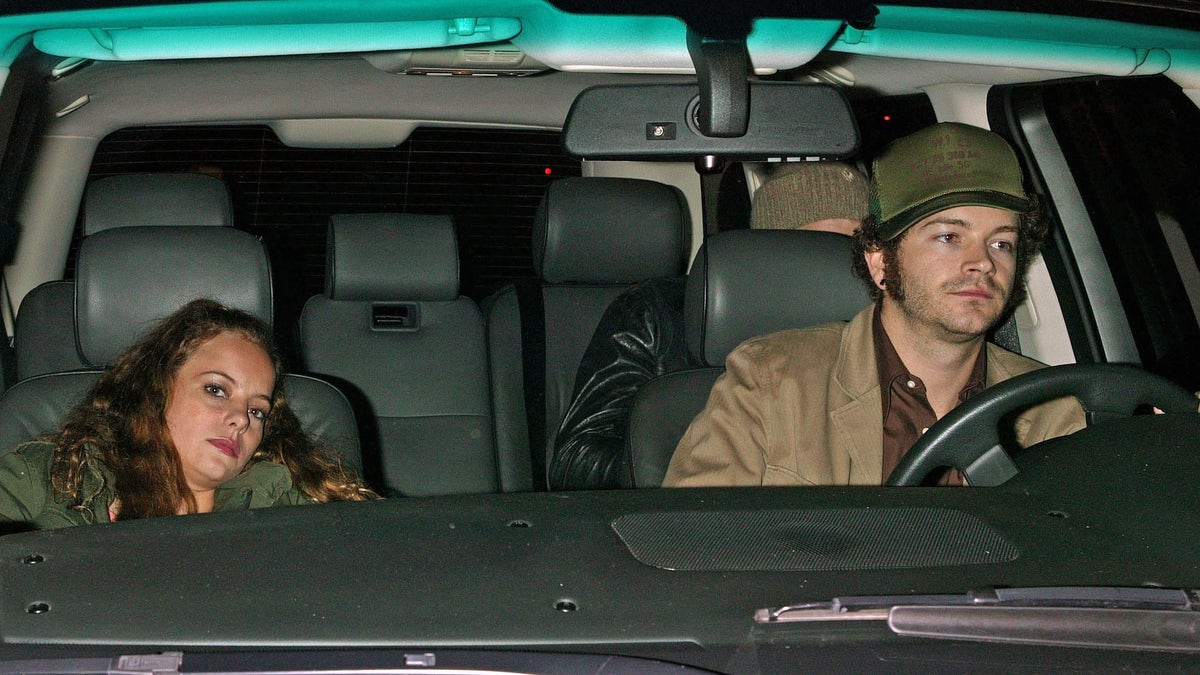Bijou Phillips and Danny Masterson in a car