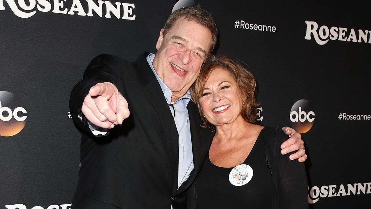 A photo of John Goodman and Roseanne Barr