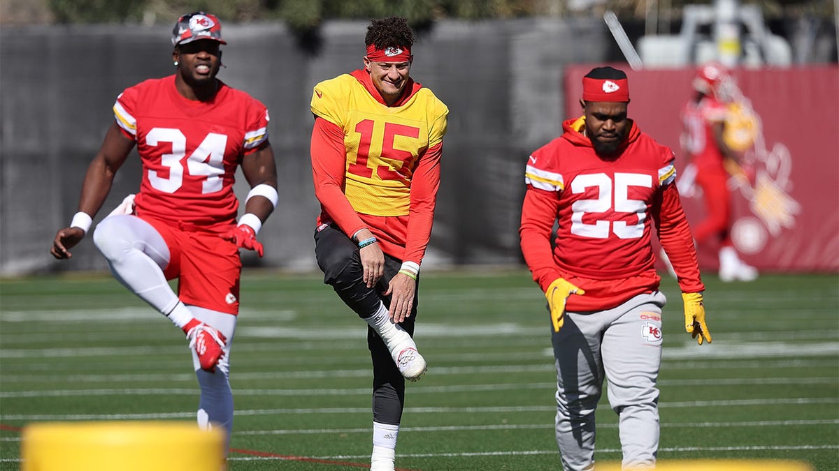 Melvin Gordon III on the practice field with Pat Mahomes