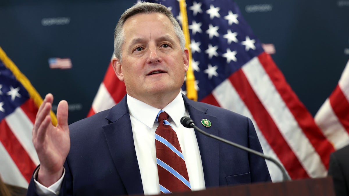 Rep. Bruce Westerman (R-AR) with US flags behind him