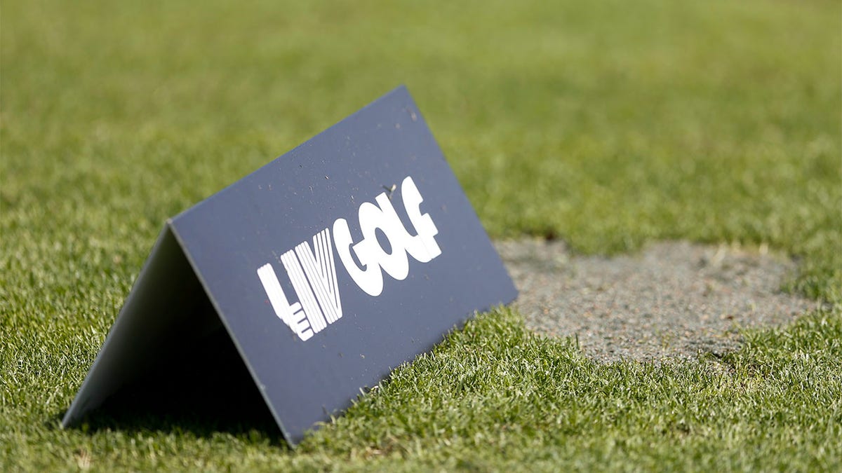 A LIV Golf sign on the practice range