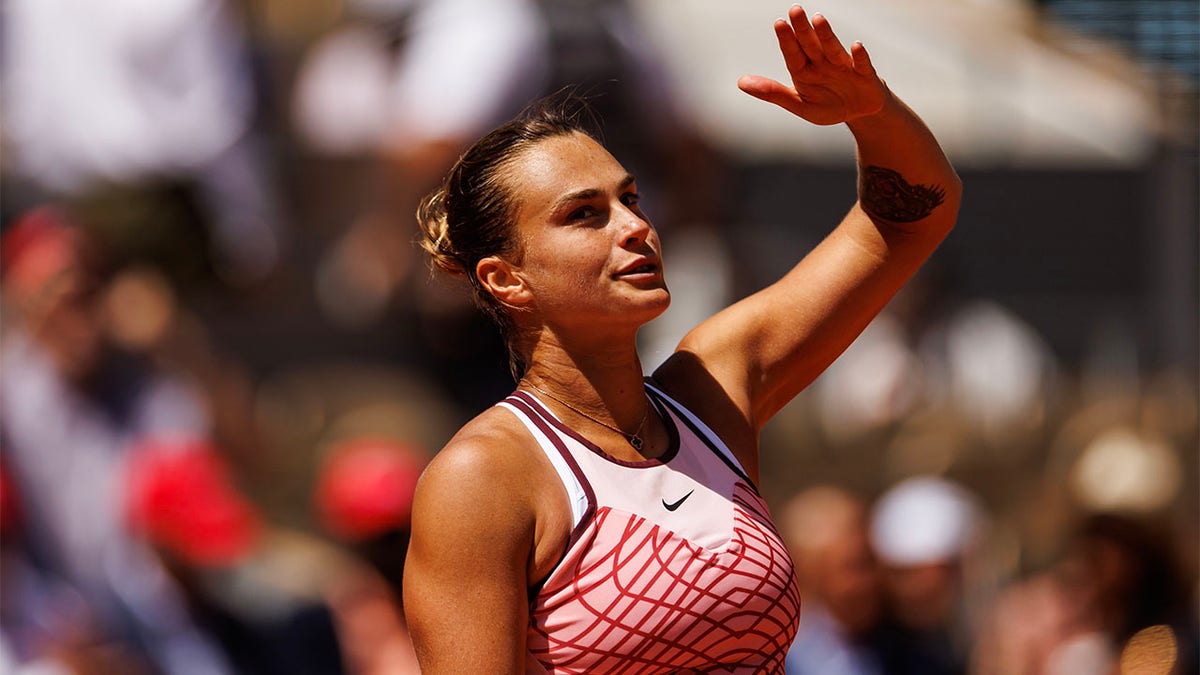 Aryna Sabalenka celebrates a French Open victory