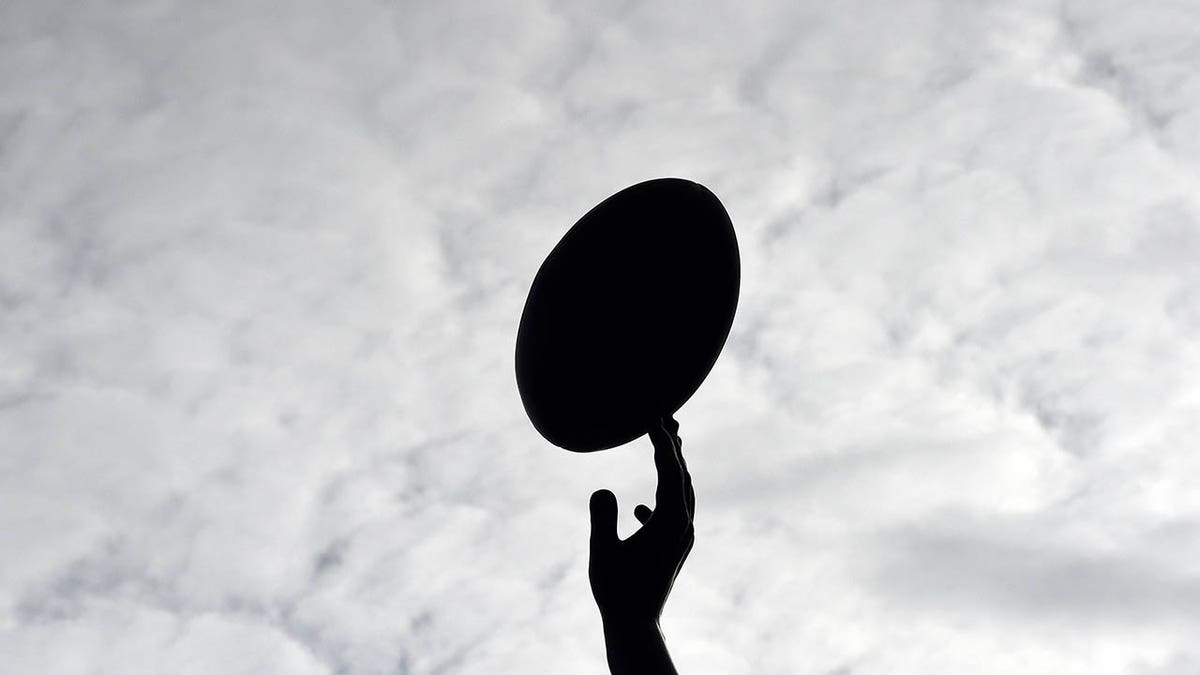 A Rugby player catches the ball