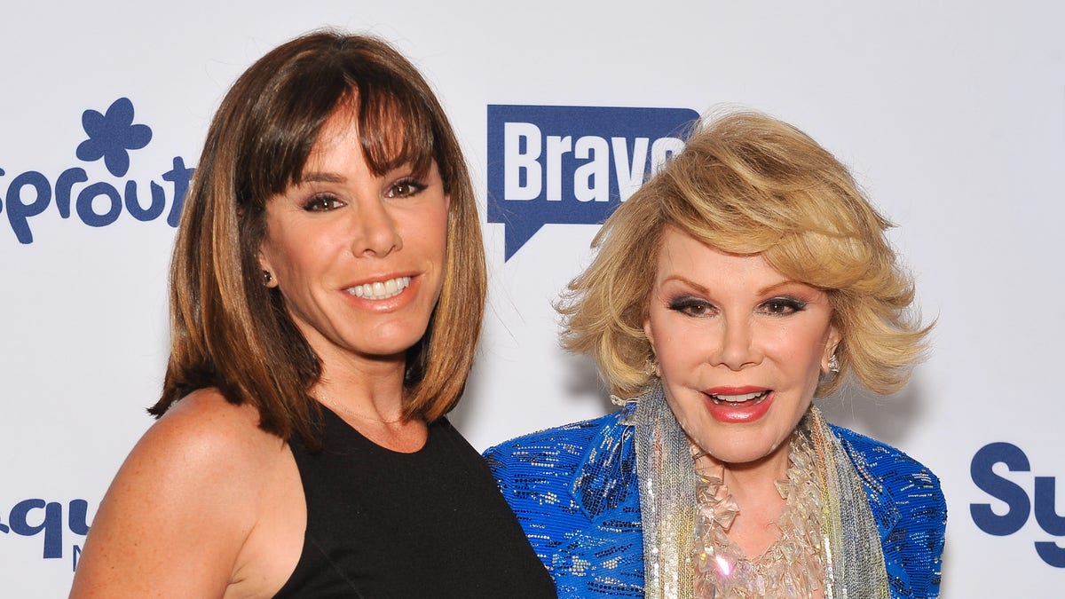 Melissa Rivers in a black top and Joan Rivers in a blue jacket
