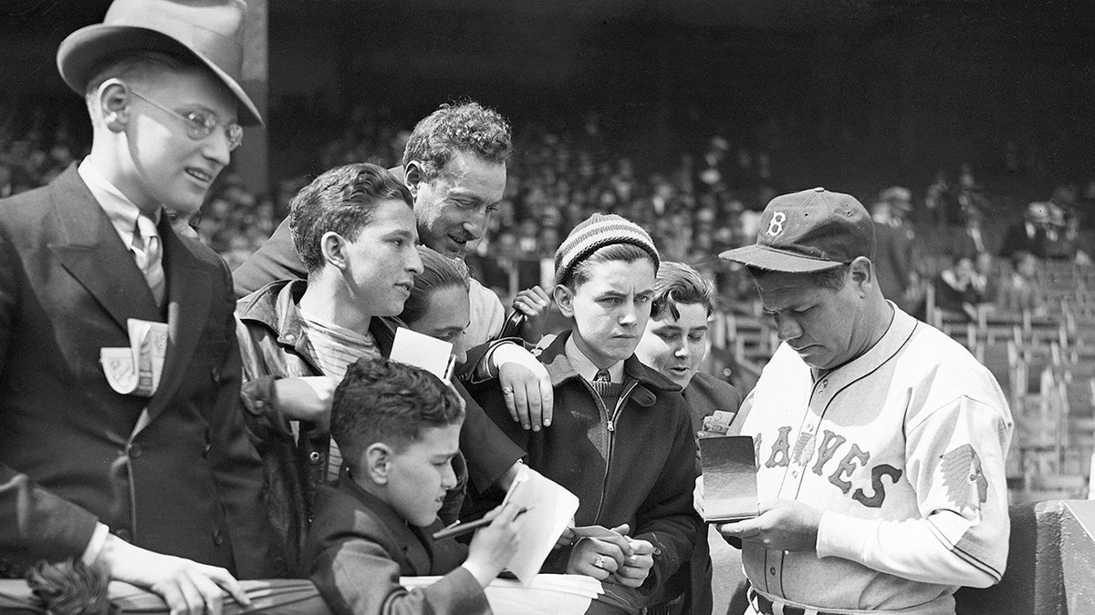 Babe Ruth signing autographs