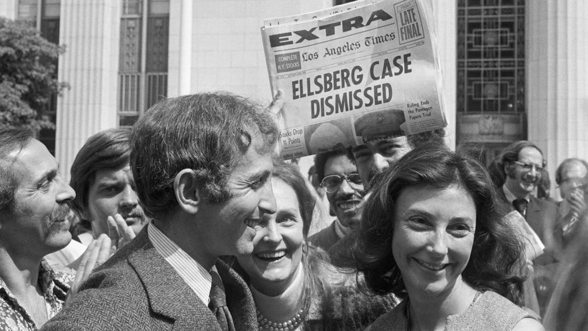 Ellsberg smiling with wife