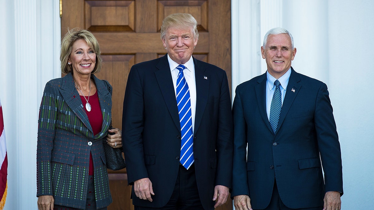 Betsy DeVos, Donald Trump, Mike Pence