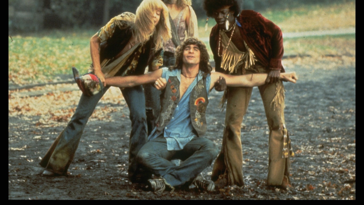 Treat Williams, seated, in a scene from Hair