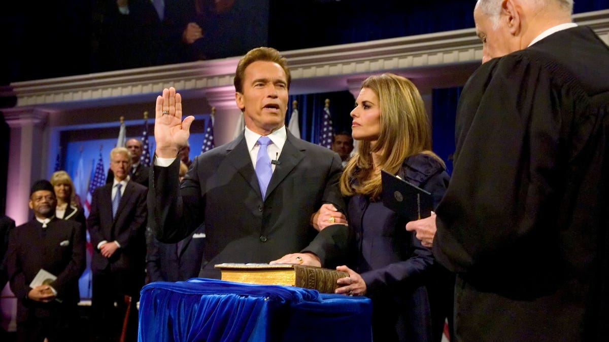 Arnold Schwarzenegger, with then wife Maria Shriver, being sworn in for his second term as governor