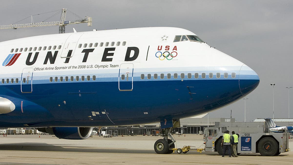 united airlines plane on runway