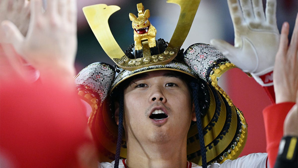 Shohei Ohtani celebrates hitting a home run