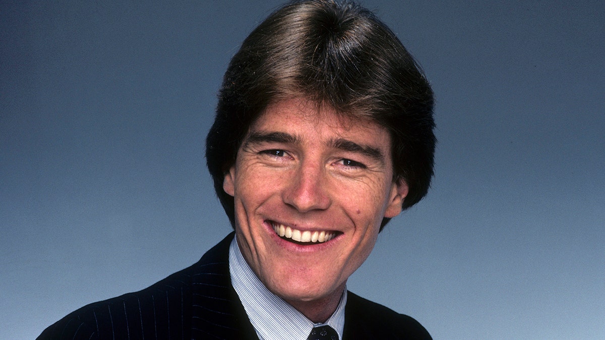 A young Bryan Cranston smiling for a promo shoot in 1983