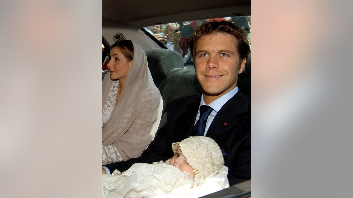 Emanuele Filiberto with his daughter Vittoria inside a car for her christening