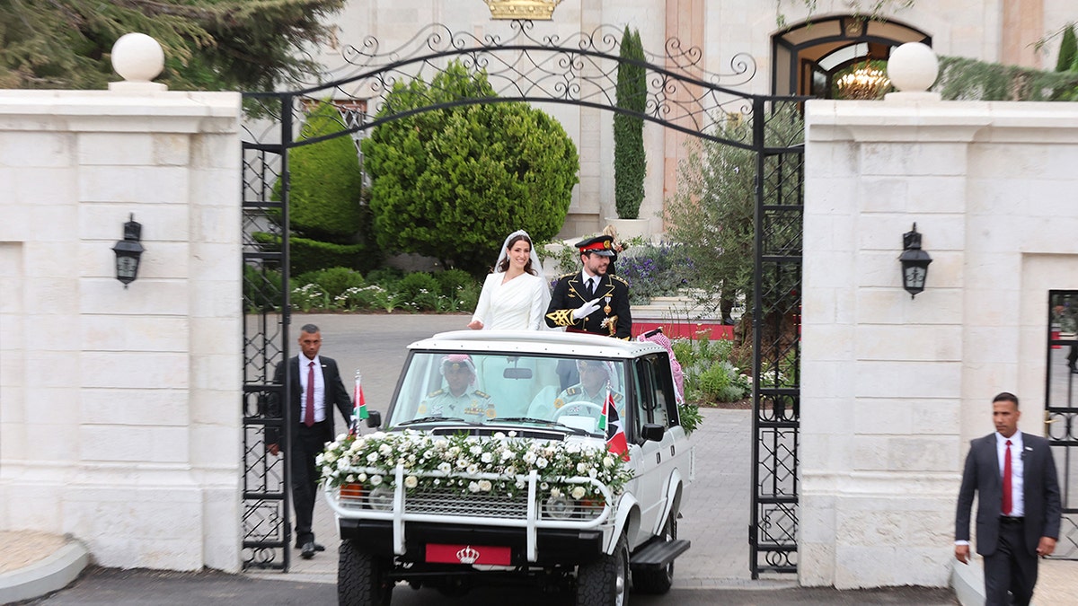 Jordans Crown Prince Hussein (R) and his wife Saudi Rajwa al-Seif in their car