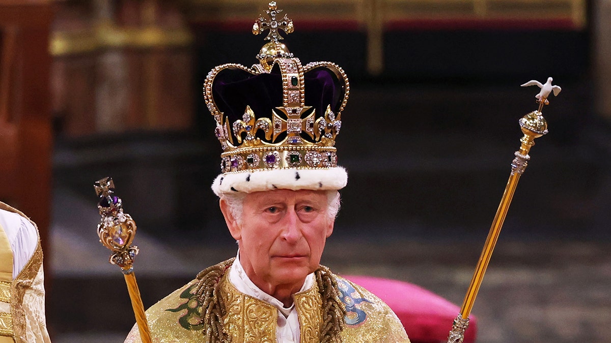 A close-up of King Charles wearing his royal regalia during his coronation