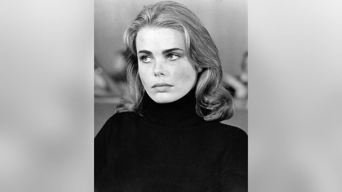 Margaux Hemingway wearing a black turtleneck