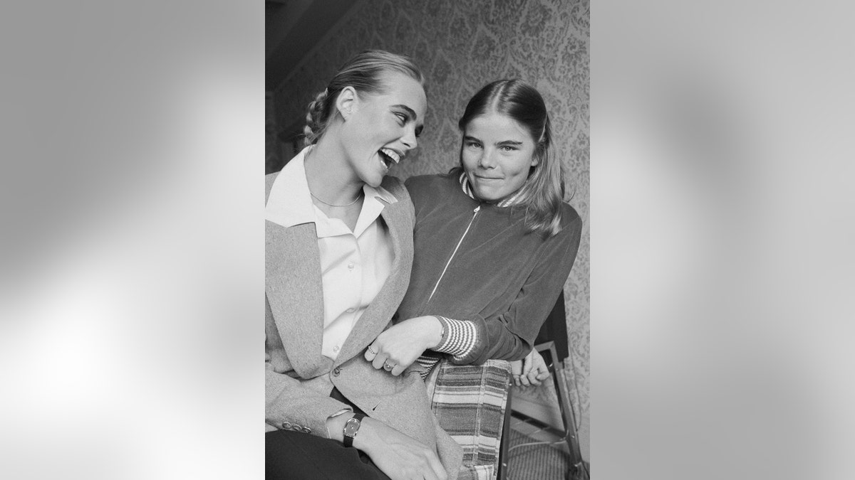 Margaux and Mariel Hemingway sharing a healthfelt moment in a black and white photo