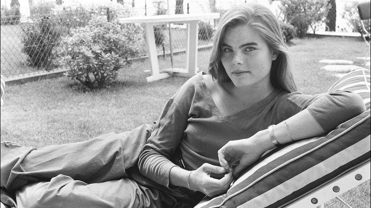 Mariel Hemingway lounging in a black and white photo