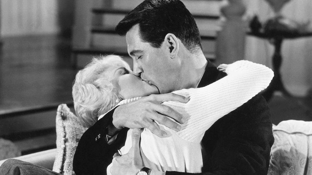 Doris Day and Rock Hudson passionately kissing