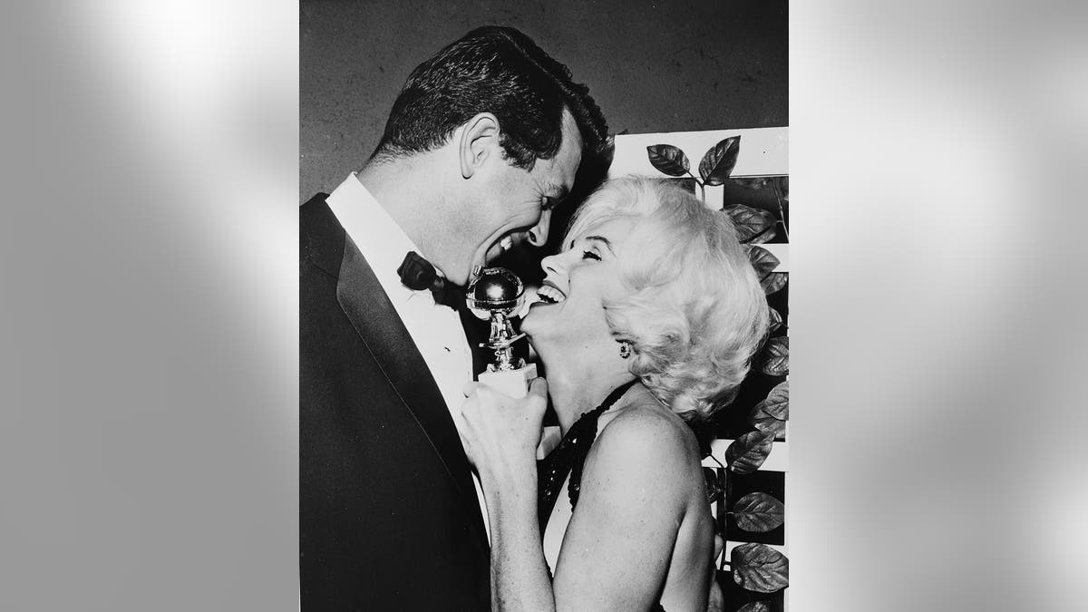 Rock Hudson and Marilyn Monroe sharing a sweet embrace at the Golden Globes