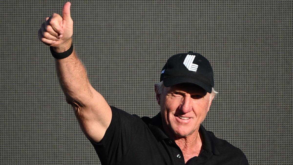 Greg Norman waves