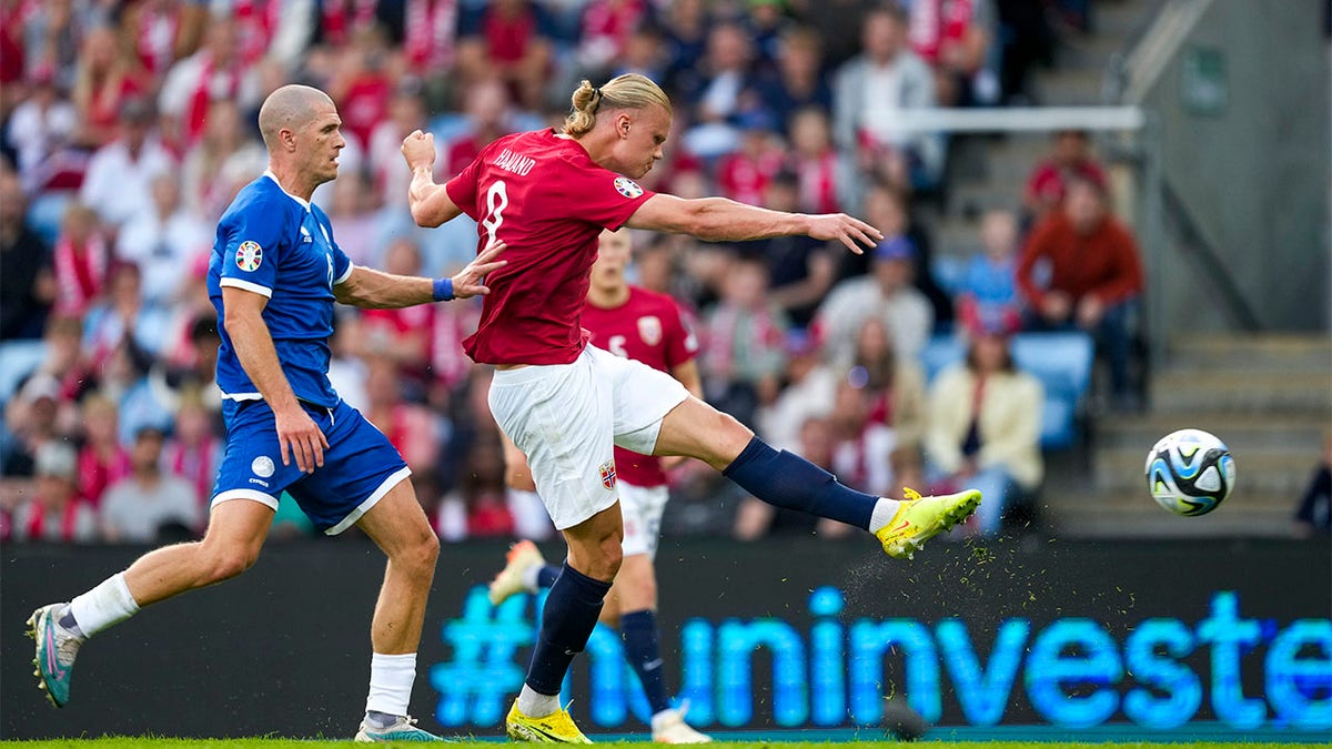 Erling Haaland shoots ball