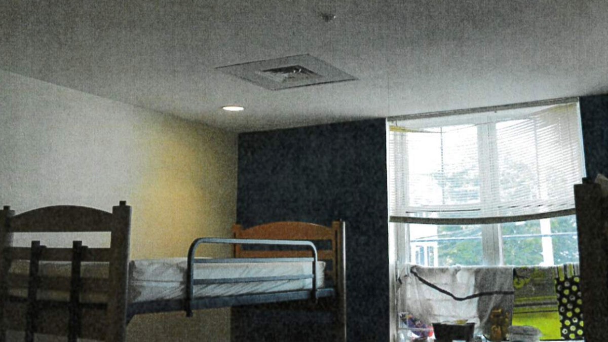 A vent is shown above a bunk bed in a bedroom.