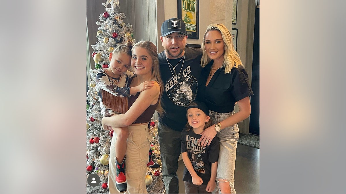 Jason Aldean poses with his children Navy, Memphis and Kendyl with his wife Brittany
