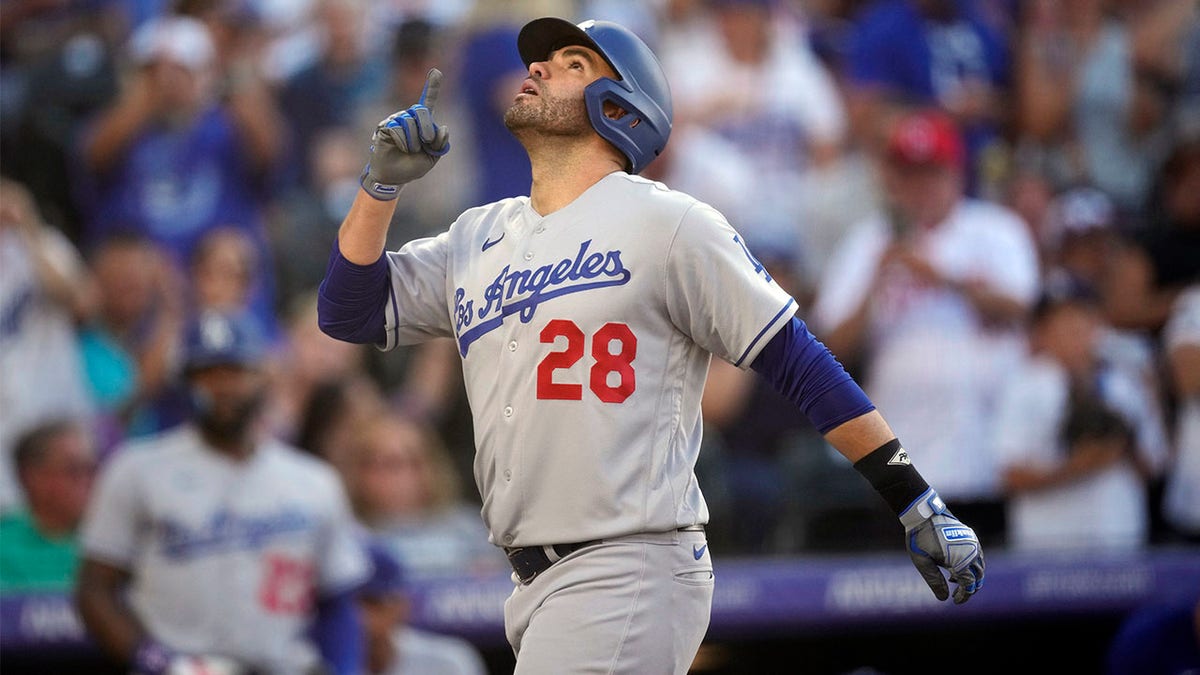 Martinez helps power Dodgers past Rockies 14-3 after severe weather delay