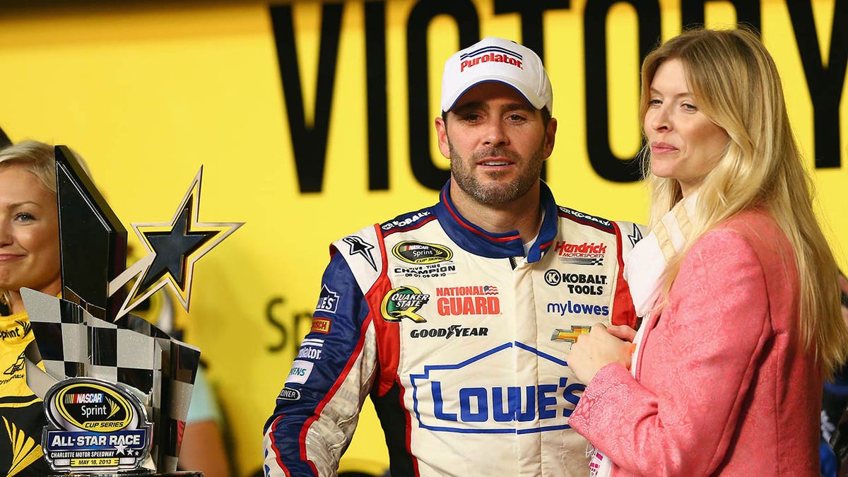 Jimmie Johnson and his wife Chandra pose for a picture